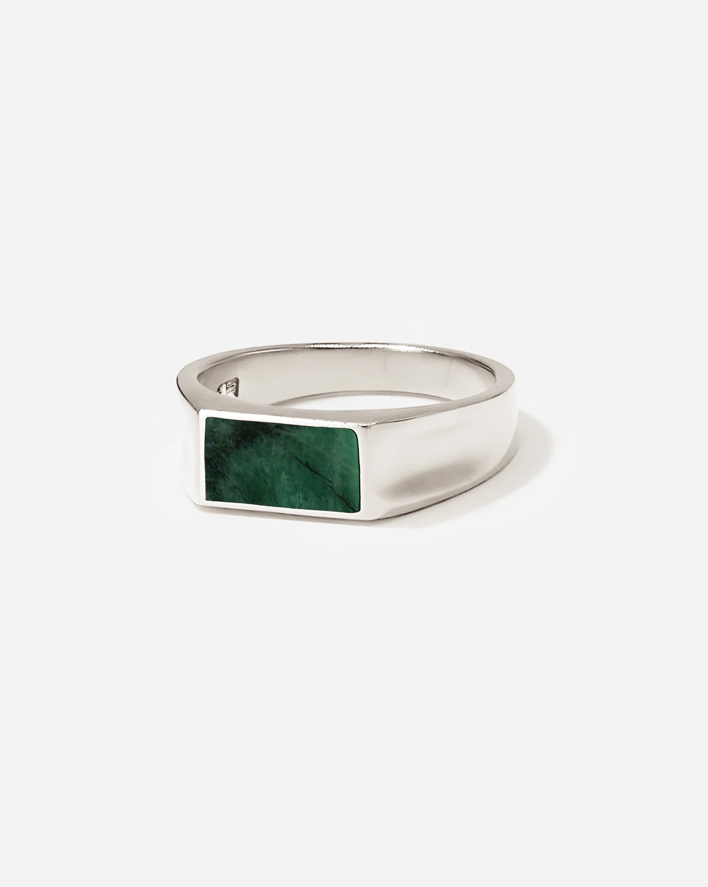  The SIlver Vale Stone Ring with its distinctive concave sides features a custom cut emerald stone.&nbsp;Taking inspiration from a vale, a tranquil valley embraced by nature, its design portrays a serene and unpretentious charm and elegance.