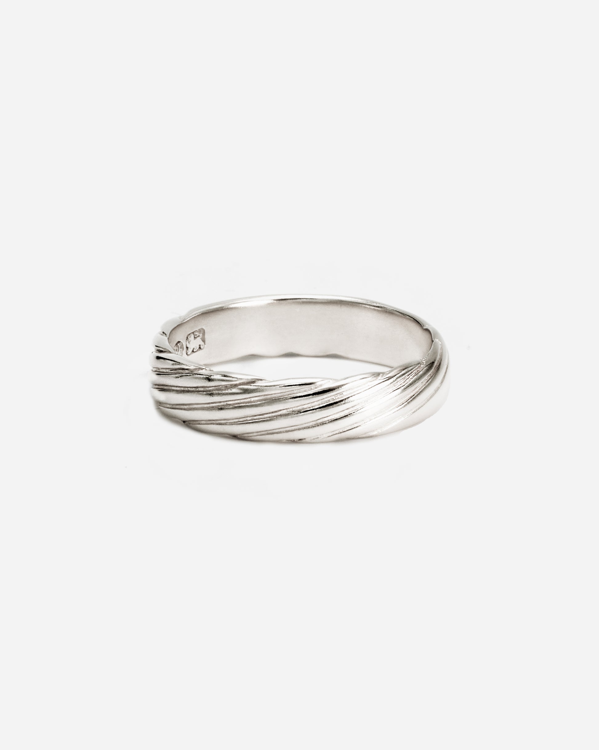 A silver band ring by bome with beautiful ridges, handmade by bome

