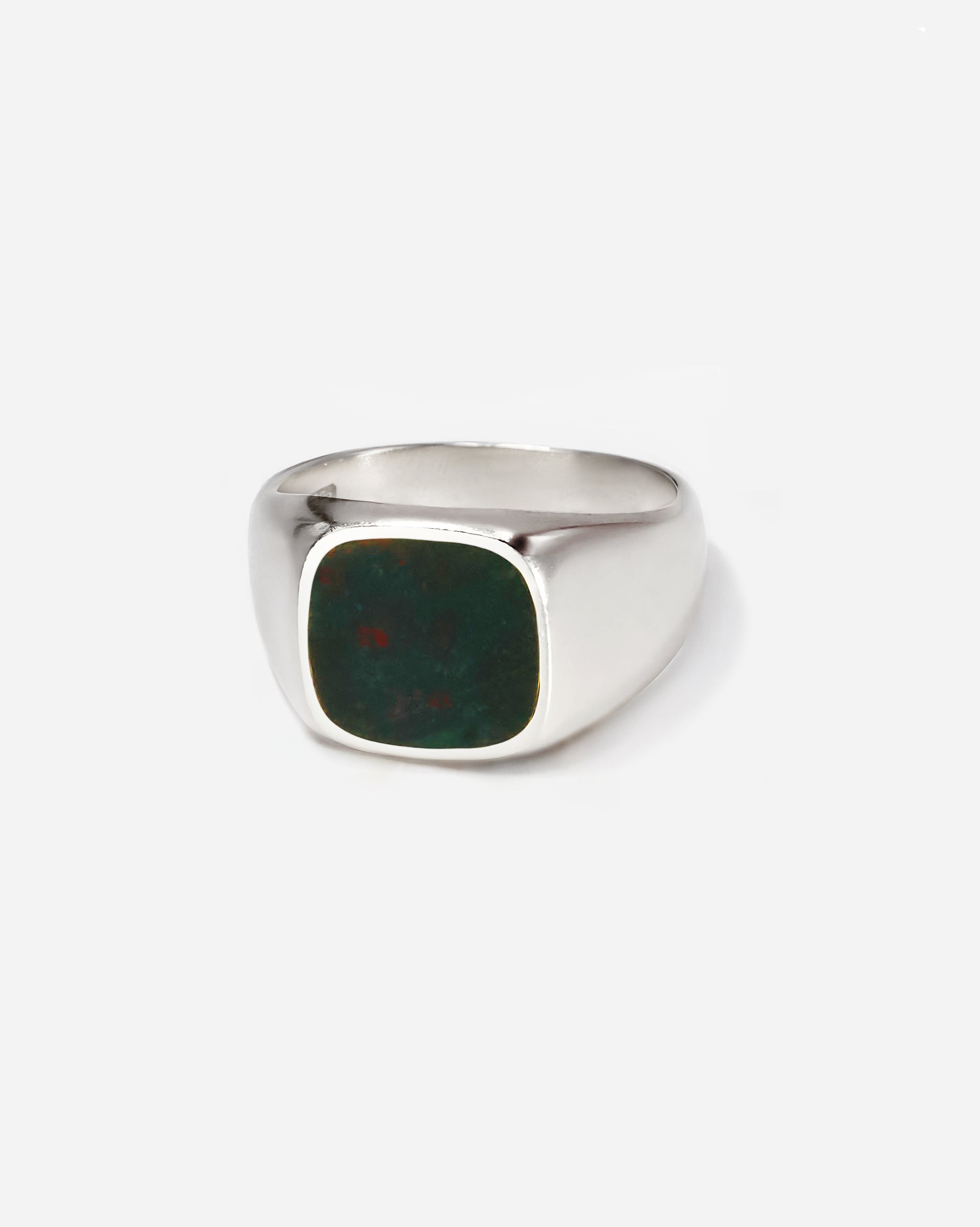 Men’s signet ring with a custom-cut emerald stone set in a sleek band, perfect as a pinky or index ring, offering effortless style and refined luxury.