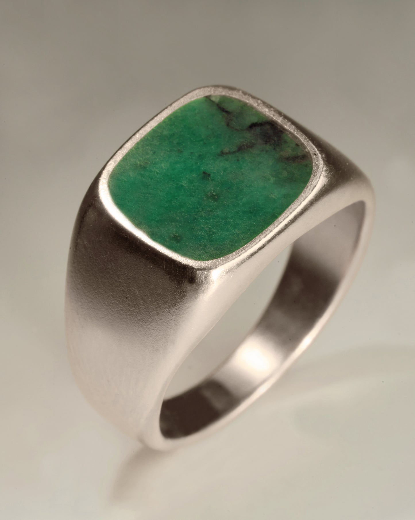 Silver signet ring by BØME with an emerald stone setting.