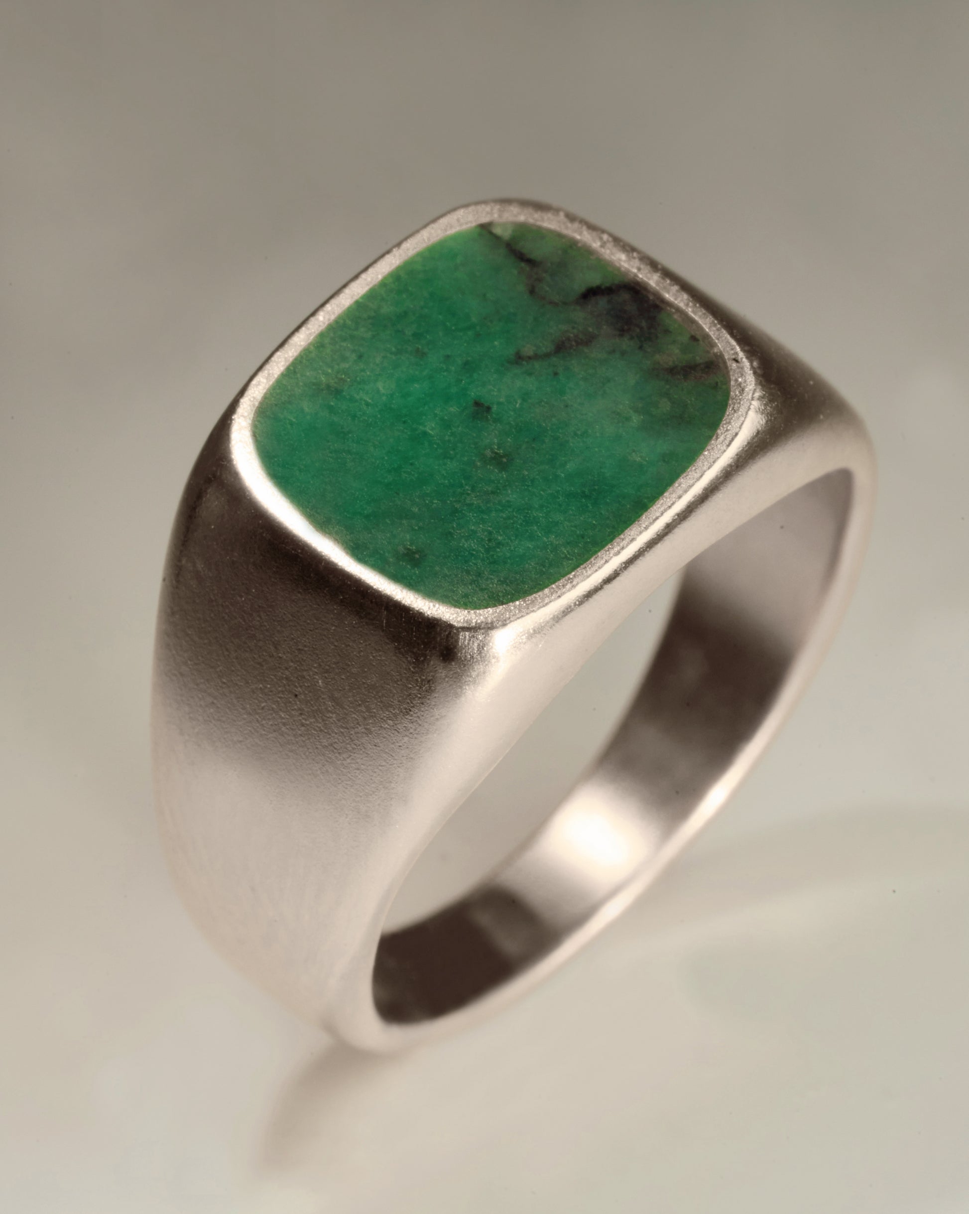 Silver signet ring by BØME with an emerald stone setting.